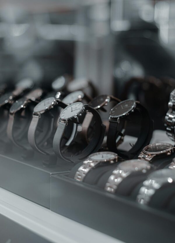 A detailed view of luxury wristwatches displayed in a store showcase, highlighting style and sophistication.