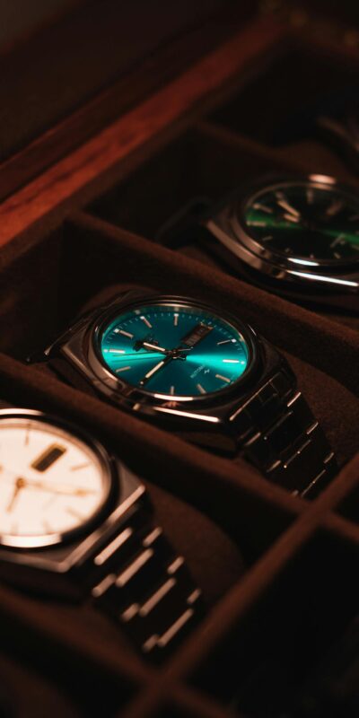 Showcase of elegant luxury watches in a display case with warm lighting.